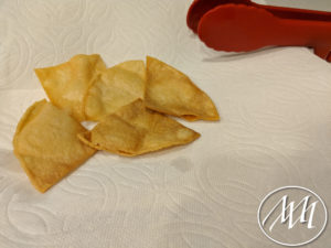 Chips draining on a plate