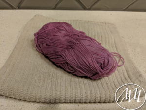 Drying yarn on counter on towel