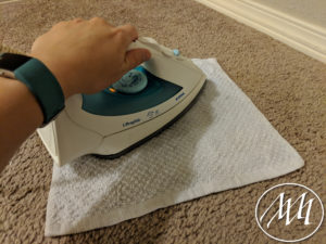 Steam wash cloth with iron to draw stain out of carpet