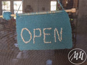 Blue knitted open sign apricot yarn & Supply
