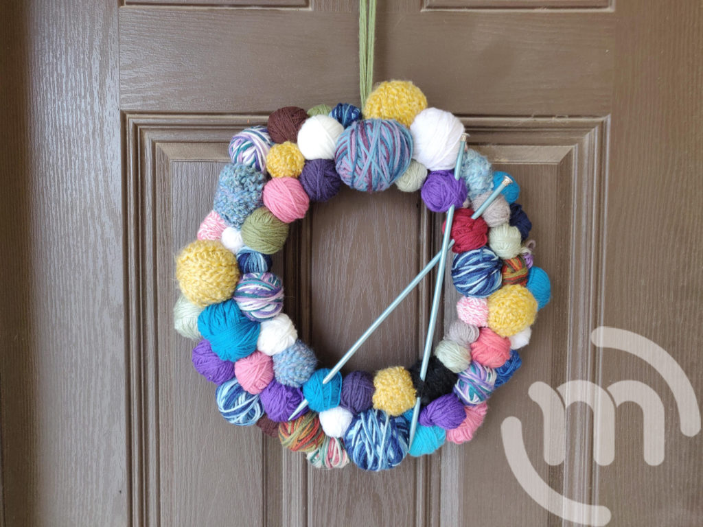 Finished Ball of Yarn Wreath with Knitting Needles 