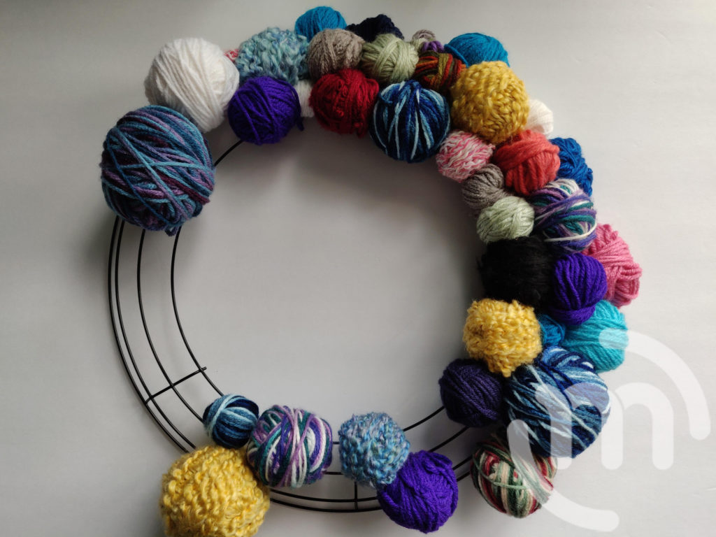 Half finished ball of yarn wreath
