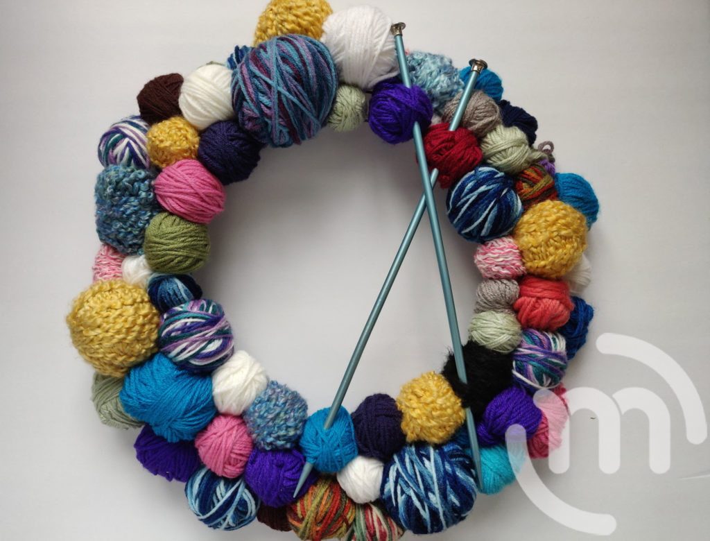 Adding knitting needles to your wreath