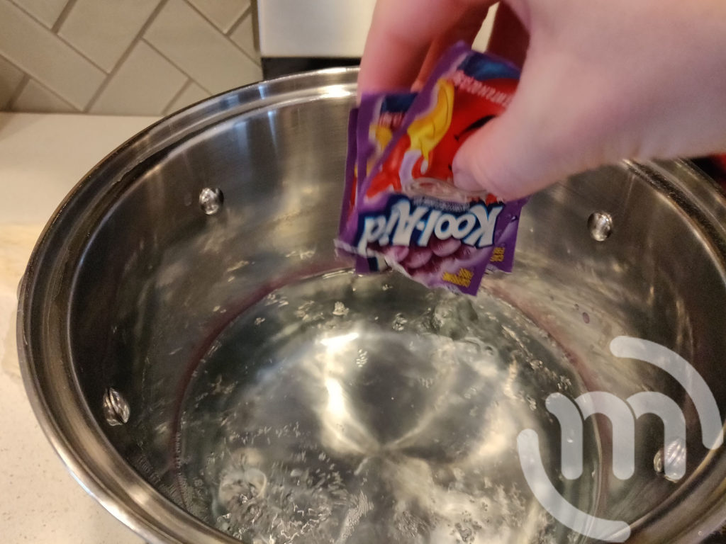 Adding Grape Kool-aid to water