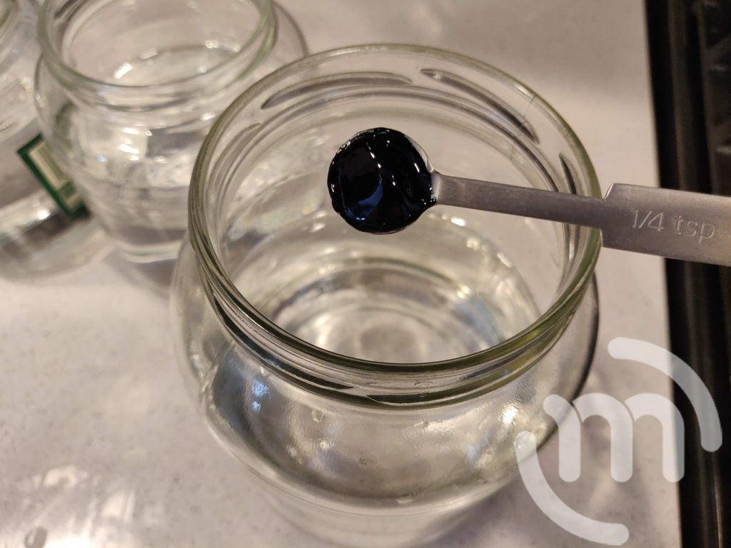 Add food coloring to jar with water